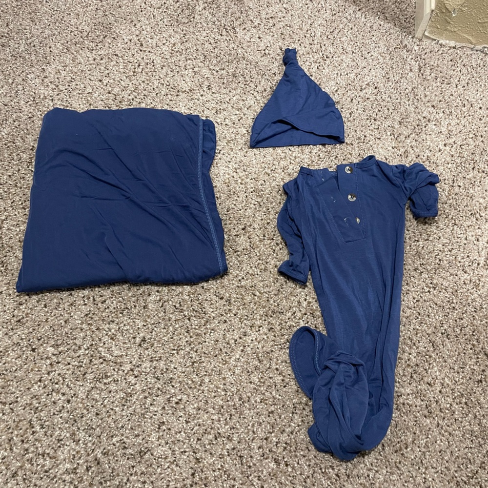 Newborn swaddle, gown, and hat